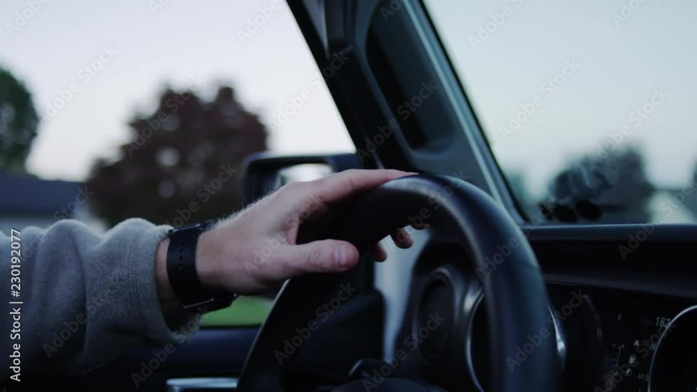 Closeup Of Man Tapping His Steering Wheel To The Beat Of A Song, Slow Motion Closeup Of Man Tapping His Steering Wheel To The Beat Of A Song, Slow Motion
