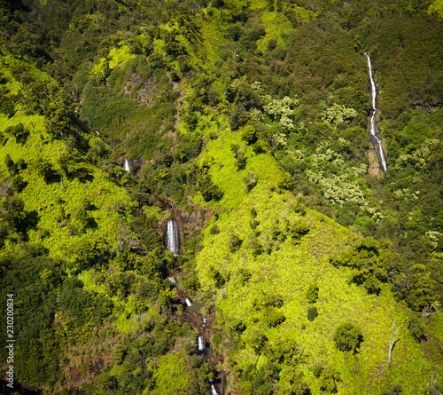 Cascading waterfalls, aerial shot from a helicopter, Kauai, Hawaii.