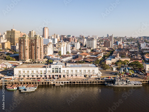 Panoramic view of skyscrapers skyline of Latin American capital of Asuncion city, Paraguay. Embankment of Paraguay river. Birds eye aerial drone photo. Ciudad de Asunción Paraguay.