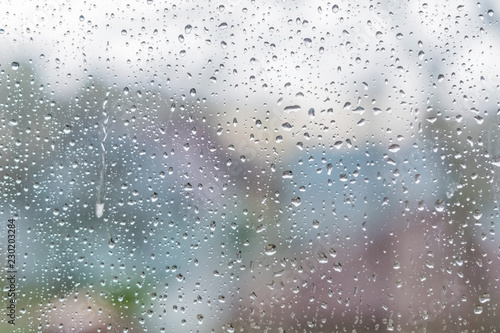 Rain drops on a window glass. Abstract background texture.