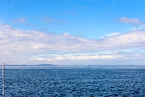 Summer afternoon view from the sea to the islands of the Body  Kuzova archipelago  in the White Sea