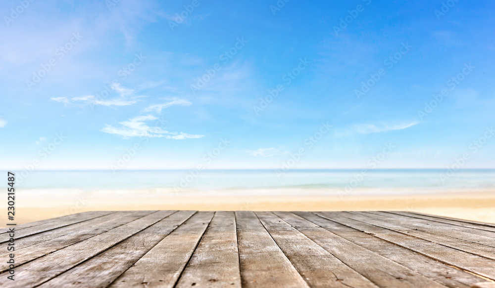wooden table top or wooden plank in front of the beach background wooden table top or wooden plank in front of the beach background