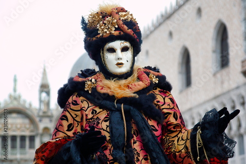 Carnival black-gold mask and costume at the traditional festival in Venice, Italy © veroja