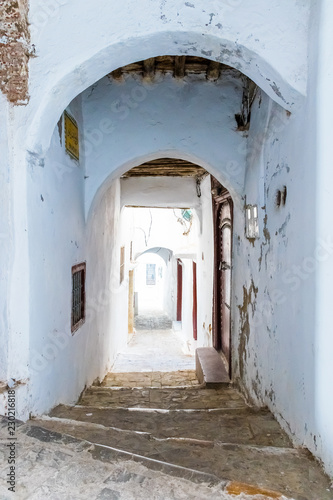 Narrow medieval street in the white medina of the Tetouan city, Morocco in Africa © pszabo