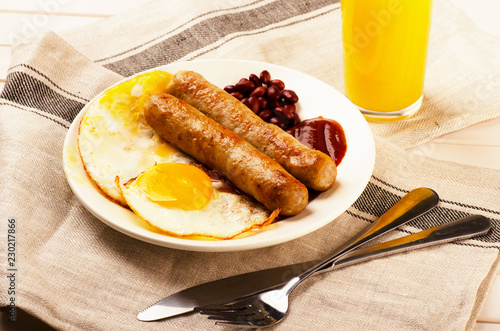 Grilled sausages with scrambled eggs