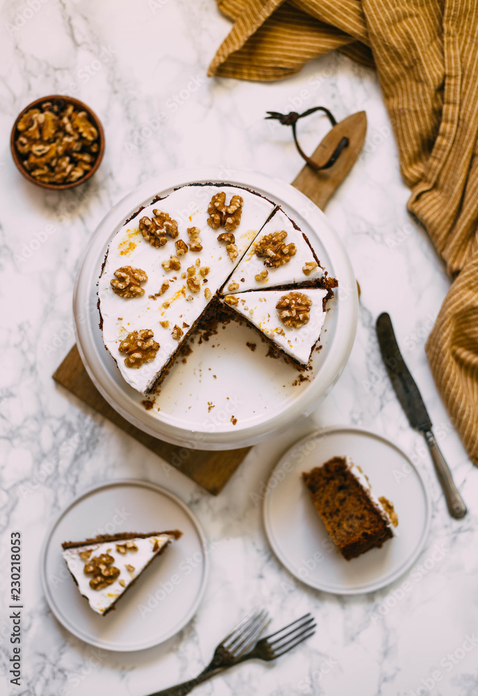 Carrot Cake with Cream Cheese Icing and walnut. Vegan and gluten free concept Carrot Cake with Cream Cheese Icing and walnut. Vegan and gluten free concept