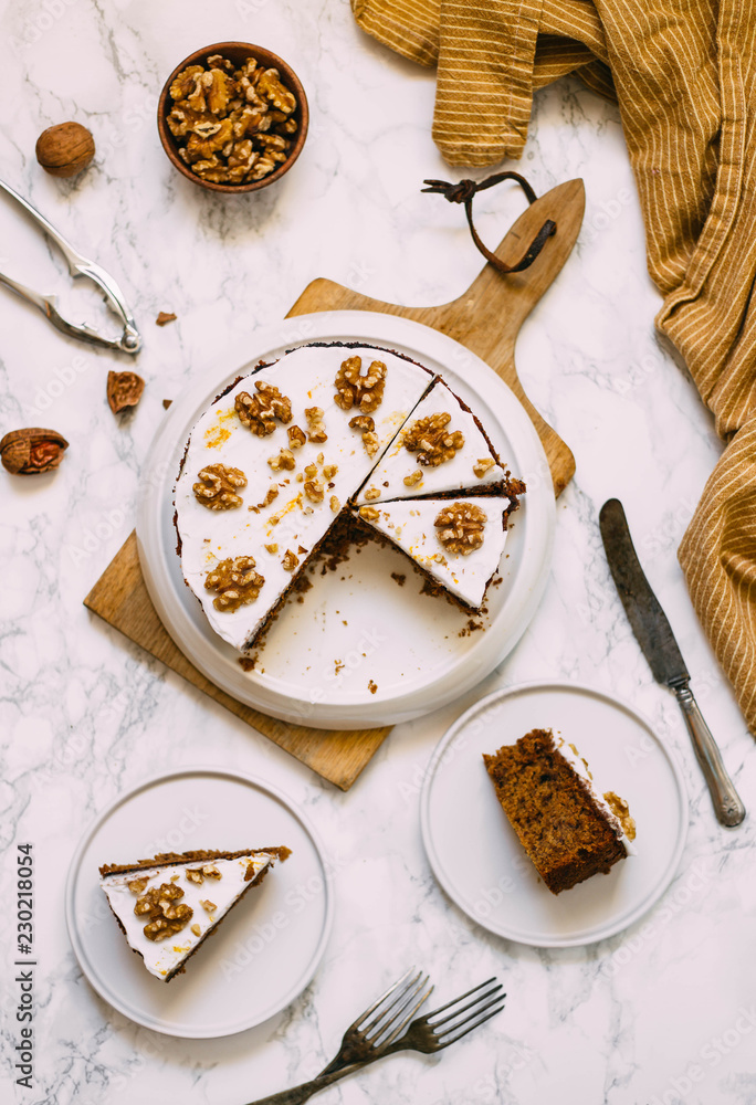 Carrot Cake with Cream Cheese Icing and walnut. Vegan and gluten free concept