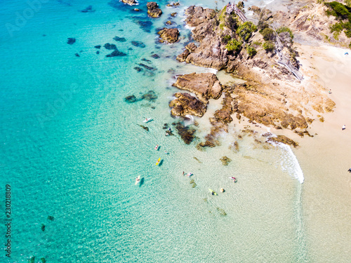 Print op canvas The Pass and Wategoes at Byron Bay from an aerial view with blue water
