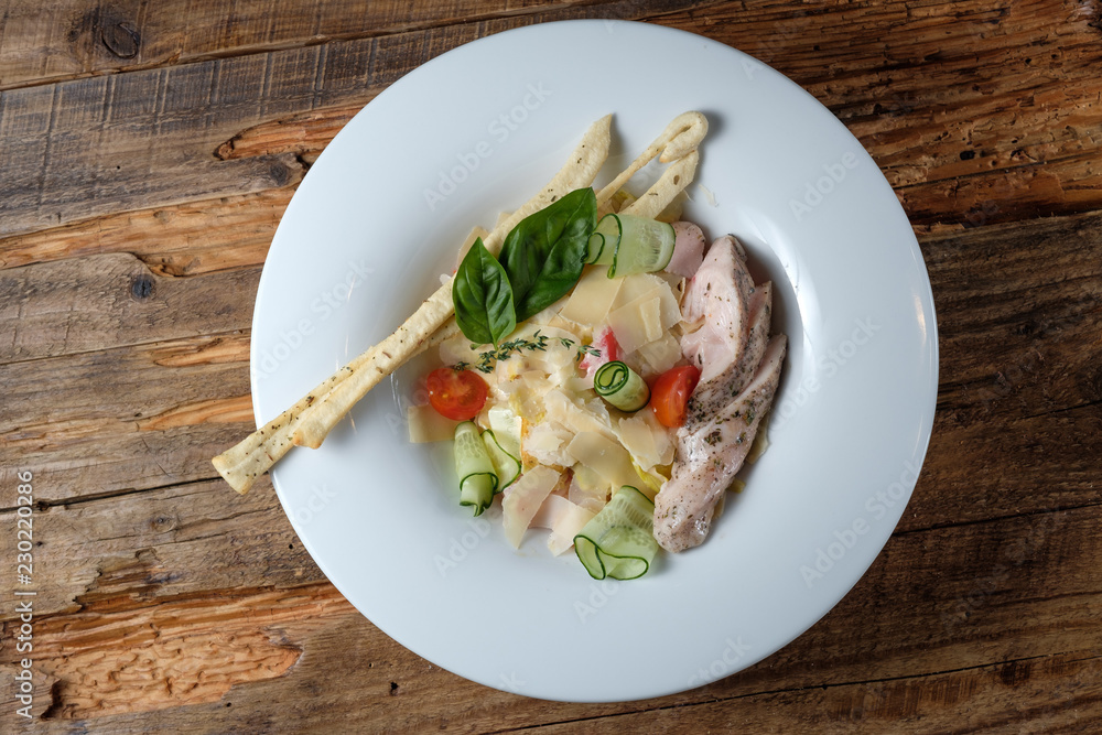 Sliced tuna with pasta, parmezan and vegetables Sliced tuna with pasta, parmezan and vegetables