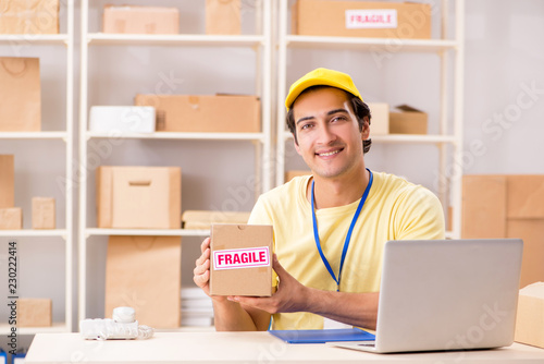 Handsome contractor working in box delivery relocation service 