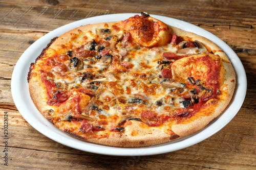 Pizza with salami and mushroom
