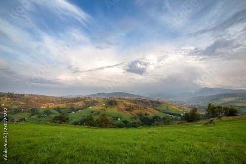 panoramic mountain view with blue cloudy sky