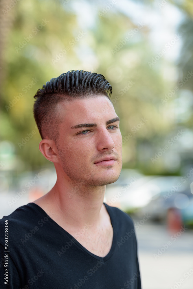 Portrait of young handsome man thinking outdoors Portrait of young handsome man thinking outdoors