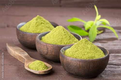 Natural sweetener in powder from stevia plant - Stevia rebaudiana. Top view