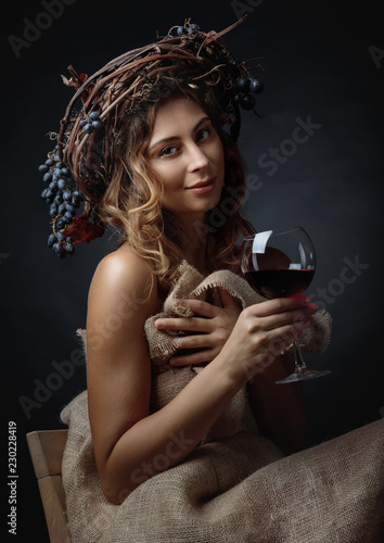  Beautiful girl with glass of red wine .