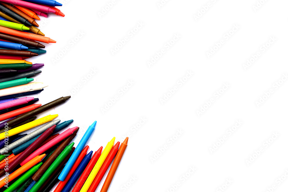 Fototapeta premium Crayons lined up isolated on white background.