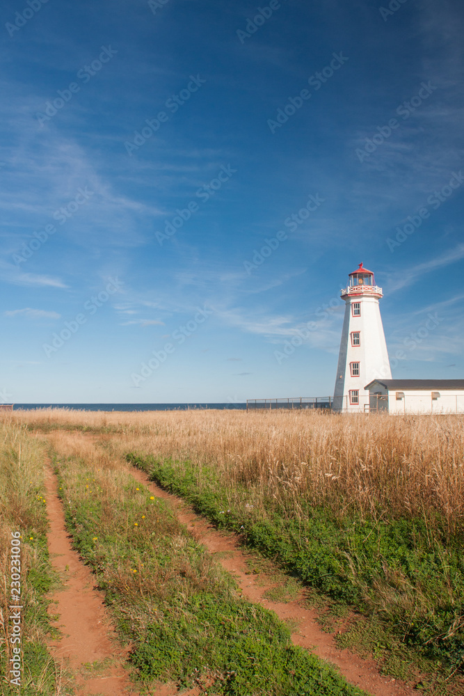 Old dirt road road leading to Prince Edward Island Lighthouse at north cape