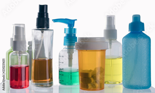 Different types of cosmetic containers and isolated medicines on a white background