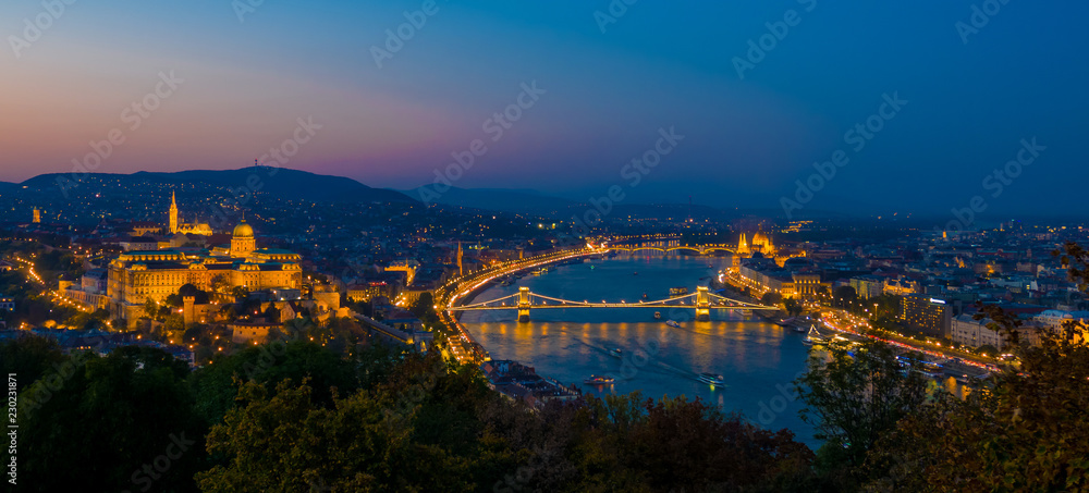 Aerial view of Budapest, Hungary by evening. Buda castle, Chain bridge and Parliament building