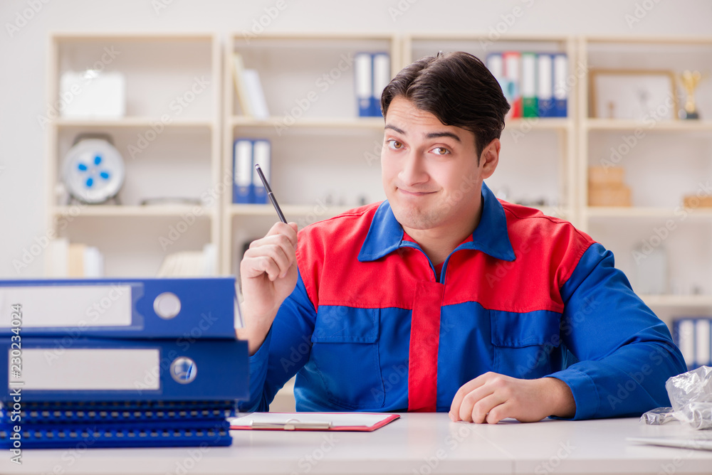 Worker in uniform working on project Worker in uniform working on project