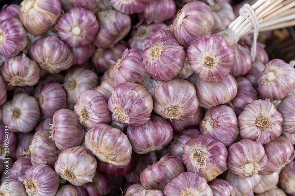 Fresh garlic at the vegetables market stall Fresh garlic at the vegetables market stall