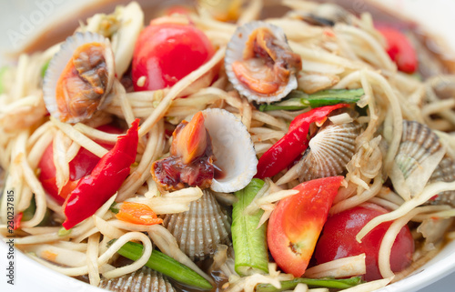 Billede på lærred Close up view and overexposure of papaya salad cockle is popular dish in Thailand