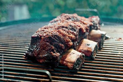 Cooking smoked beef ribs on the grill