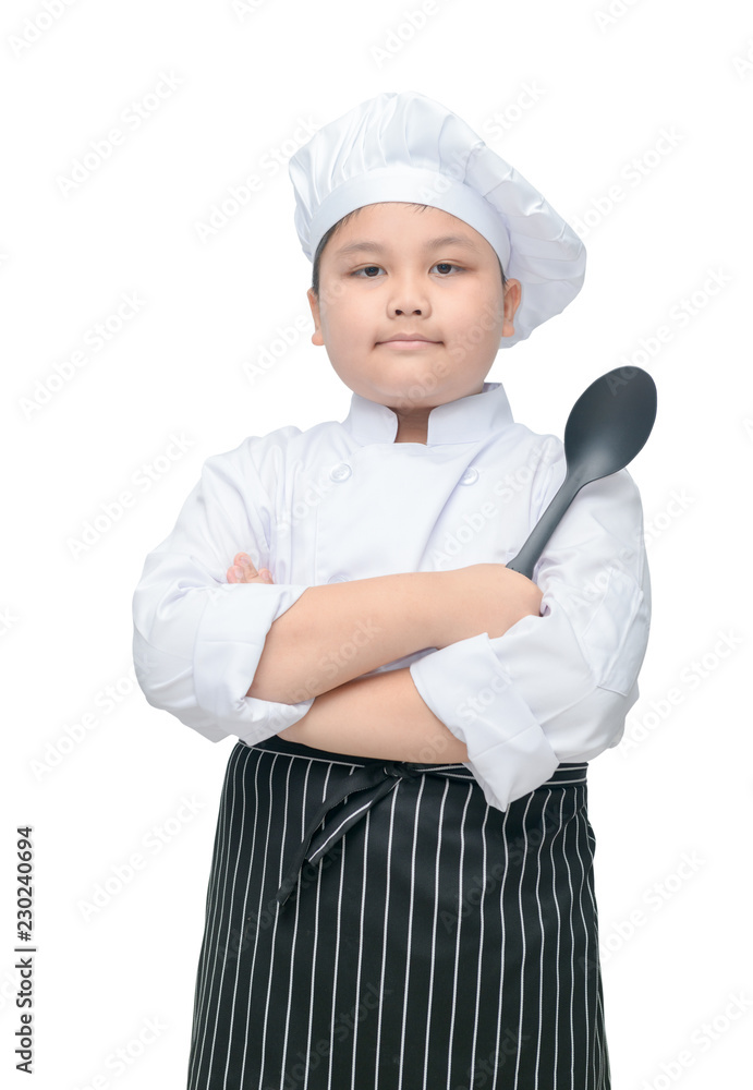 Portrait of cute boy chef hold spoon with cook hat Portrait of cute boy chef hold spoon with cook hat