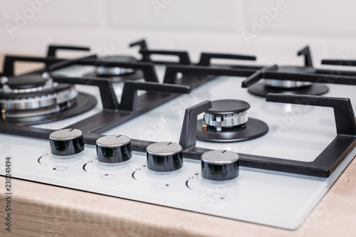 Close up of gas control panel hob in kitchen