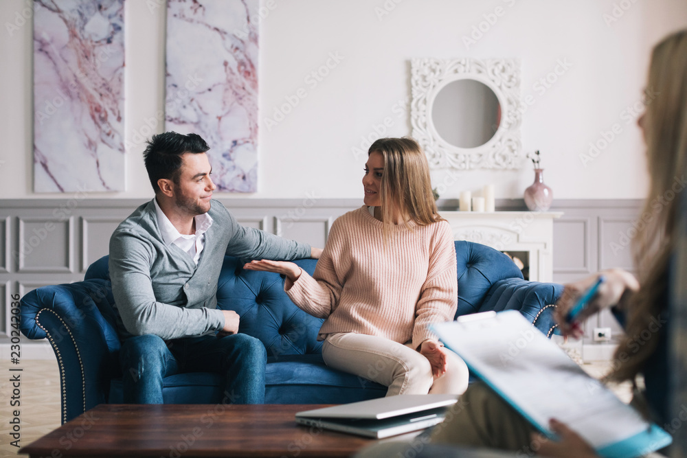 Couple visiting a psychologist and having a psychological session while dealing with problems in relationships. Couple visiting a psychologist and having a psychological session while dealing with problems in relationships.