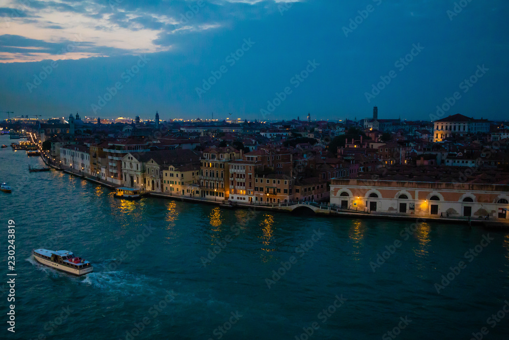 Night view of Grand Canal with old houses in Venice in Italy