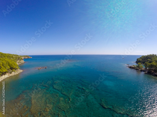 aerial view on beach and coast of sea, turquoise water, top view. Phaselis beach in Antalya, Turkey 