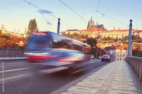 Tram on a brige in Prague with Prague Castle behind