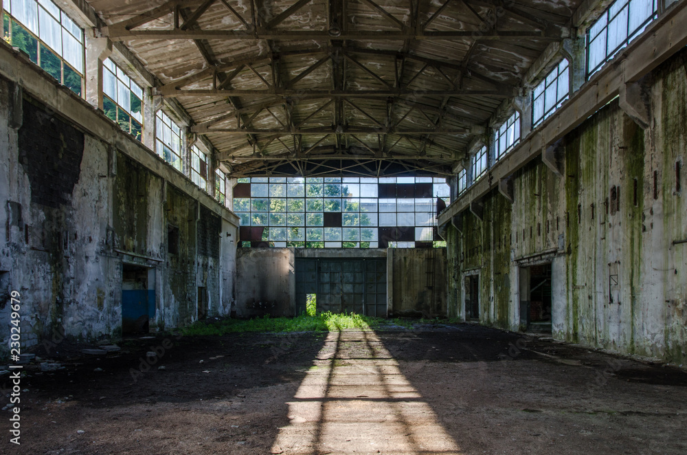Abandoned industrial hall in the morning sunshine