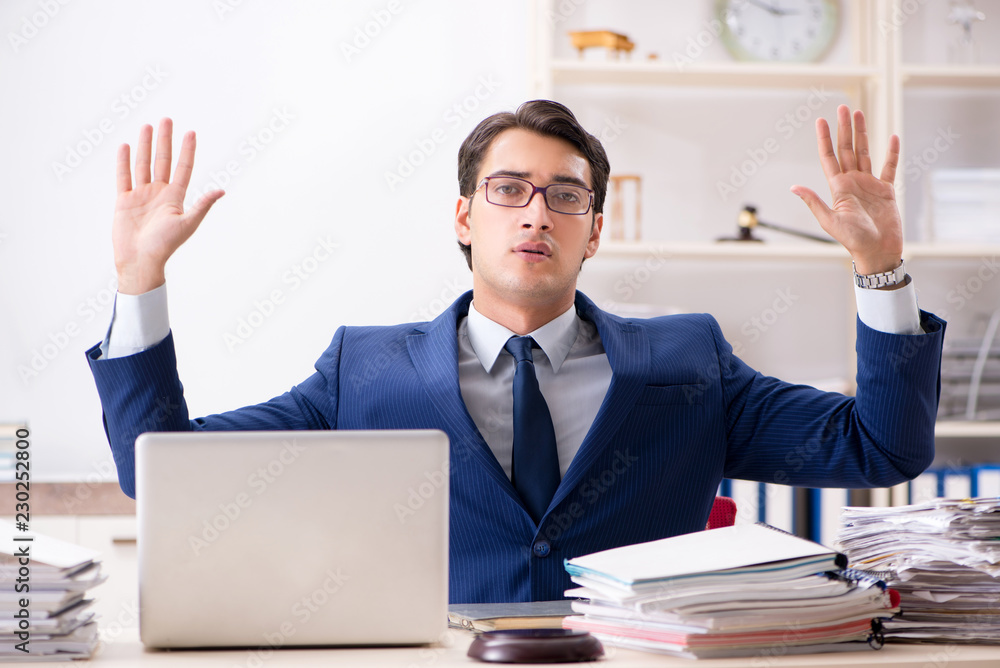 Busy man complaining about his workload Busy man complaining about his workload