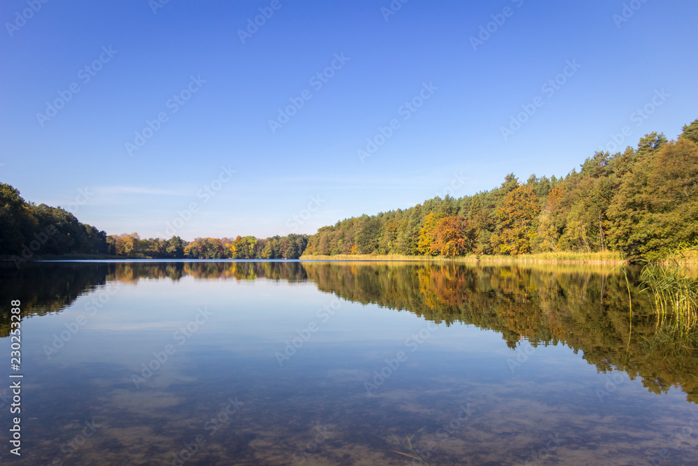 Enjoying peace on a lake - autumn landscape