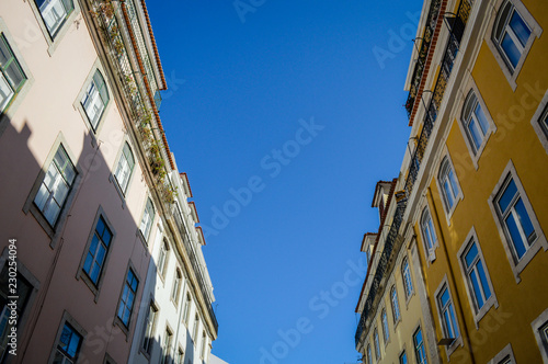 Typical portuguese streets, apartment windows and houses on traditional district scene in Lisbon, Portugal. historical structure view.
