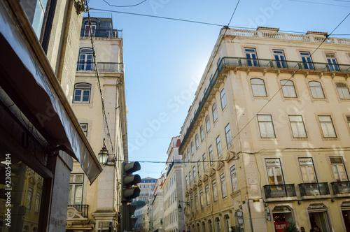 Typical portuguese streets, apartment windows and houses on traditional district scene in Lisbon, Portugal. historical structure view. © gorosi