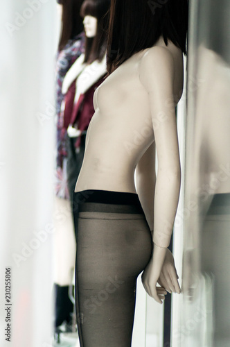 closeup of tights on nude mannequin in fashion store showroom