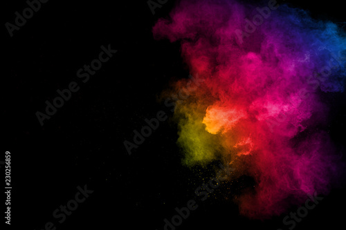 Colorful background of chalk powder. Color dust particles splattered on white background.