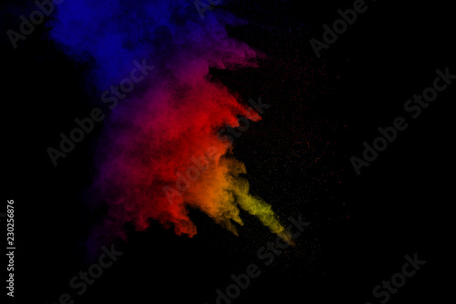 Colorful background of chalk powder. Color dust particles splattered on white background.