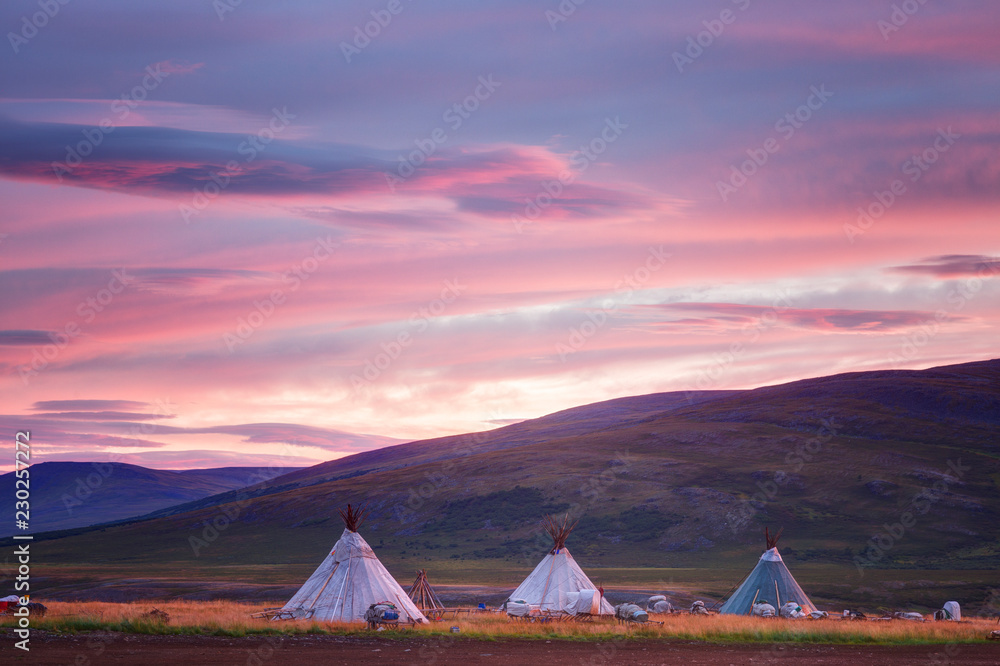 Landscape at sunrise, dwellings of nomads and mountains, Russia, Yamal