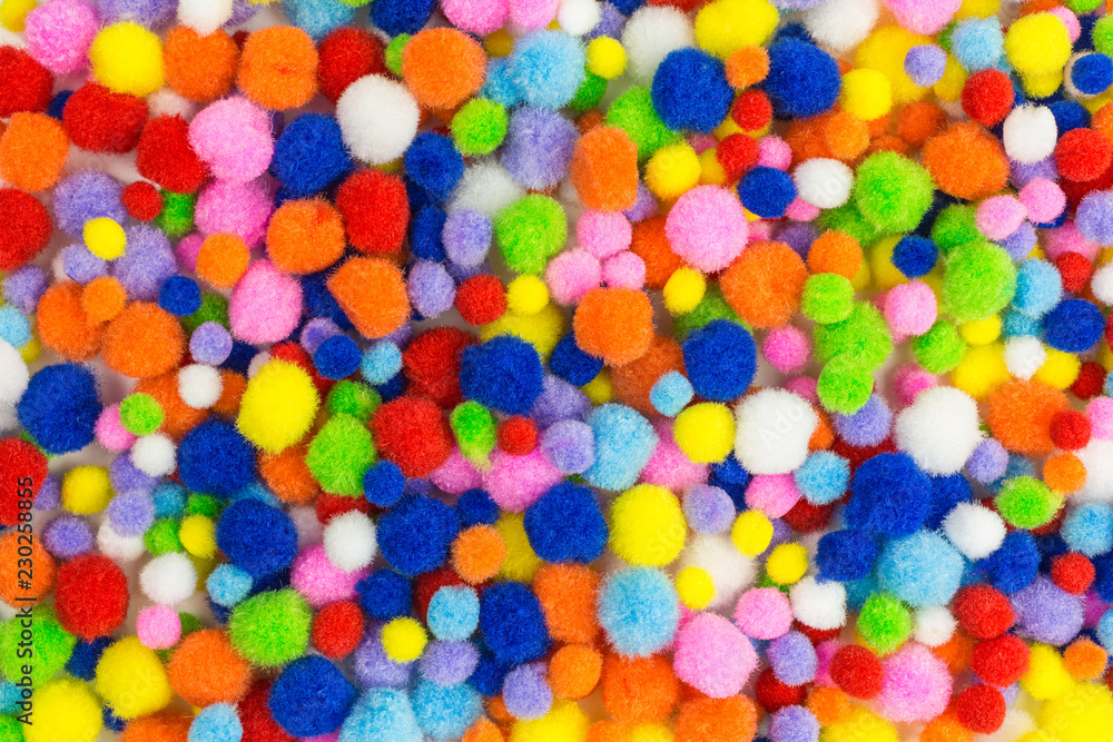 background of brightly colored pom-poms background of brightly colored pom-poms