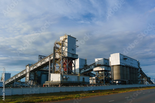 Fényképezés Industrial landscape - storage and loading hopper for loose materials with incli