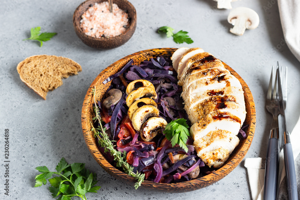 Roasted chicken breast and stewed red cabbage with mushrooms and tomatoes. Roasted chicken breast and stewed red cabbage with mushrooms and tomatoes.