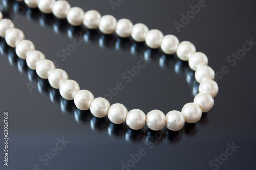 pearls necklace on black background