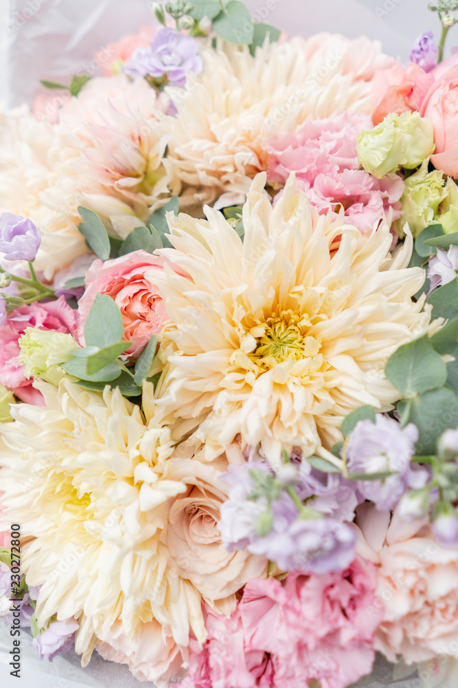 Beautiful spring bouquet in glass vase. Arrangement with various flowers. The concept of a flower shop. A set of photos for a site or catalogue. Work florist. Beautiful spring bouquet in glass vase. Arrangement with various flowers. The concept of a flower shop. A set of photos for a site or catalogue. Work florist.