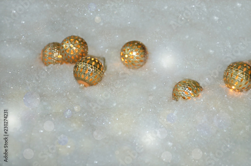 golden christmas balls in the snow