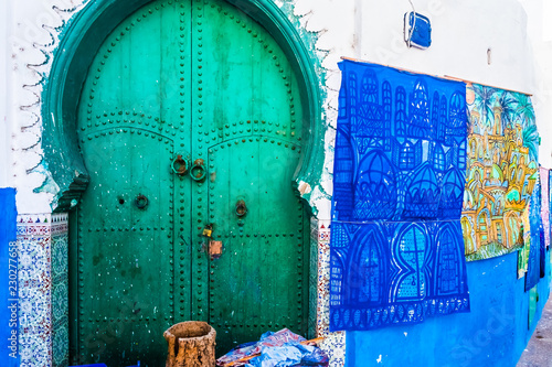 Green moroccan door in the medina of Asilah Coast City in Morocco © pszabo
