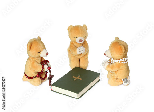 teddy bears toys praying with holy bible photo